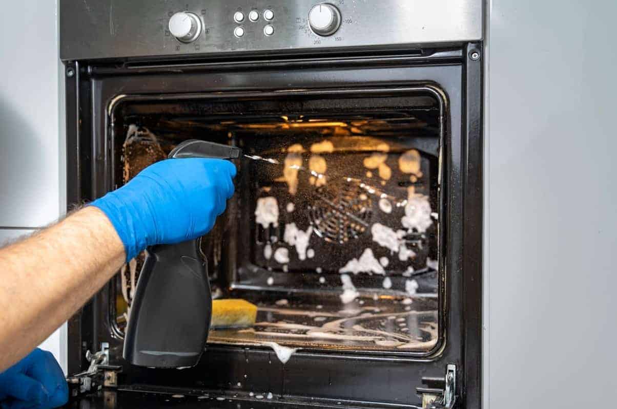 Oven being cleaned