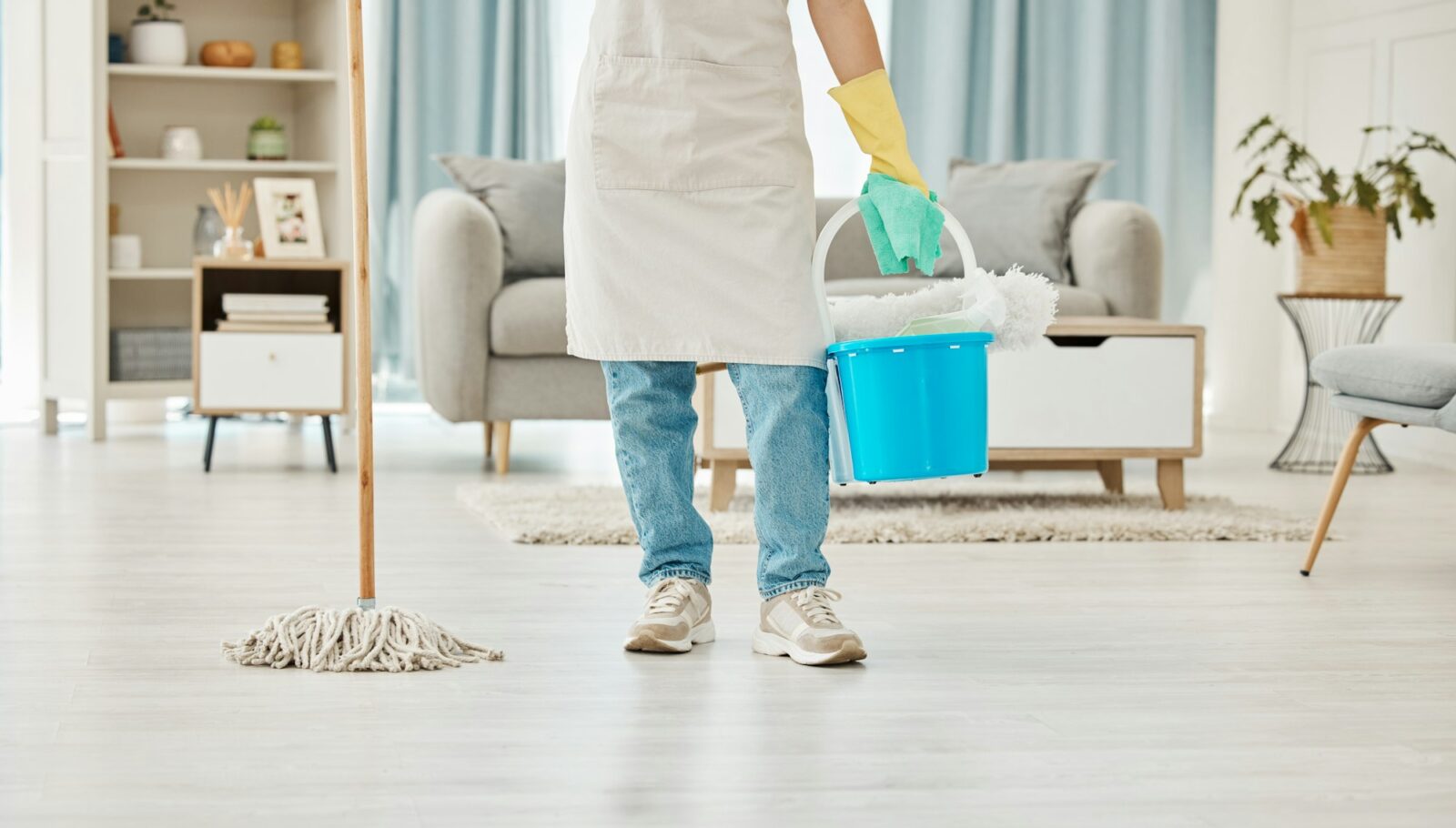 Cleaning, mop and spring cleaning equipment with woman in living room for domestic, hygiene and san